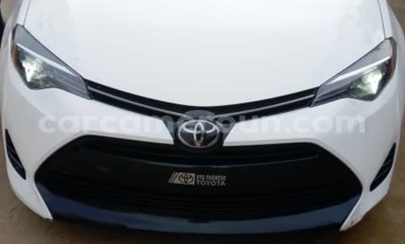 Sayi Imported Toyota Corolla White Mota in Douala a Ƙasar Kamaru Sayi Imported Toyota Corolla White Mota in Douala a Ƙasar Kamaru
